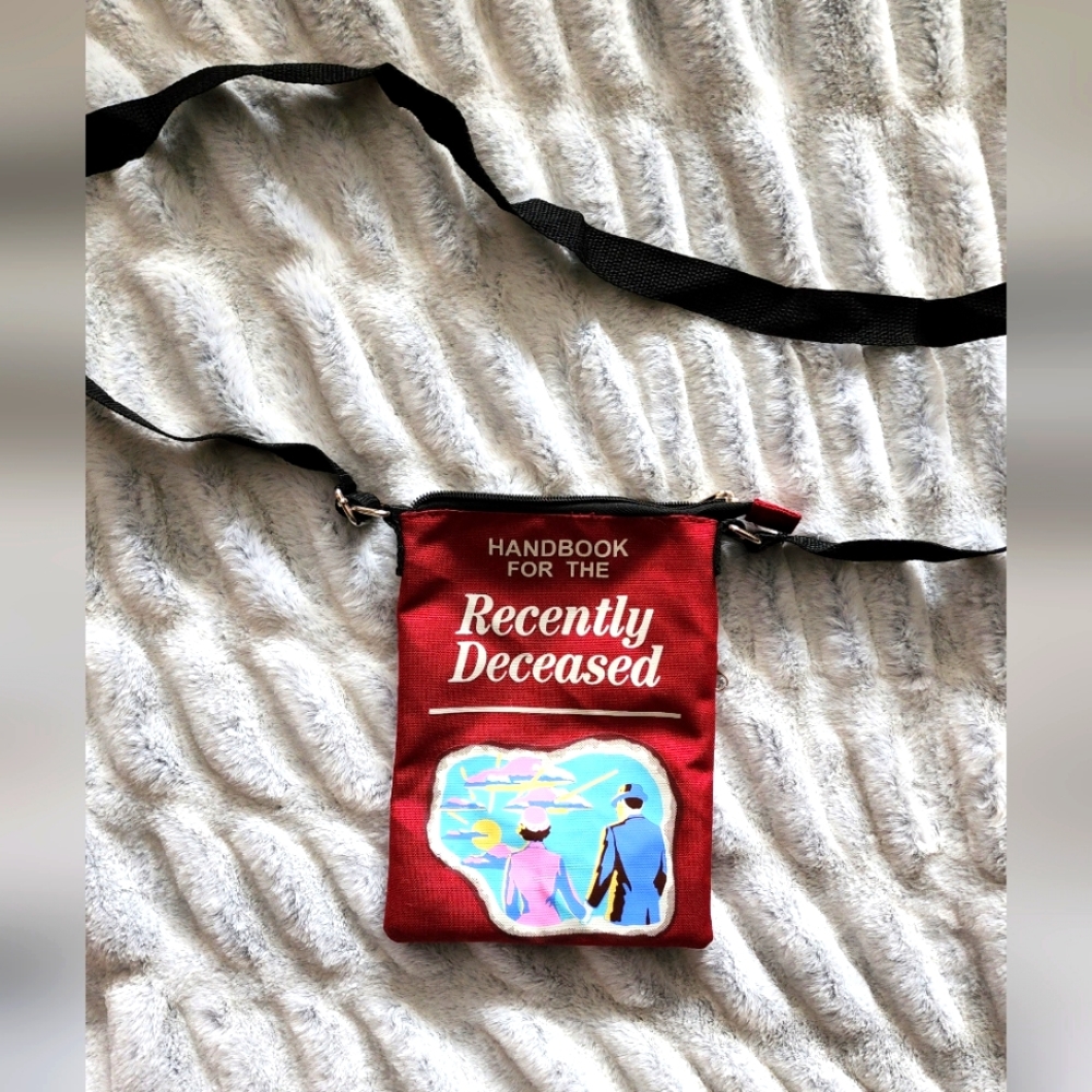 Handbook for the recently deceased crossbody purse..